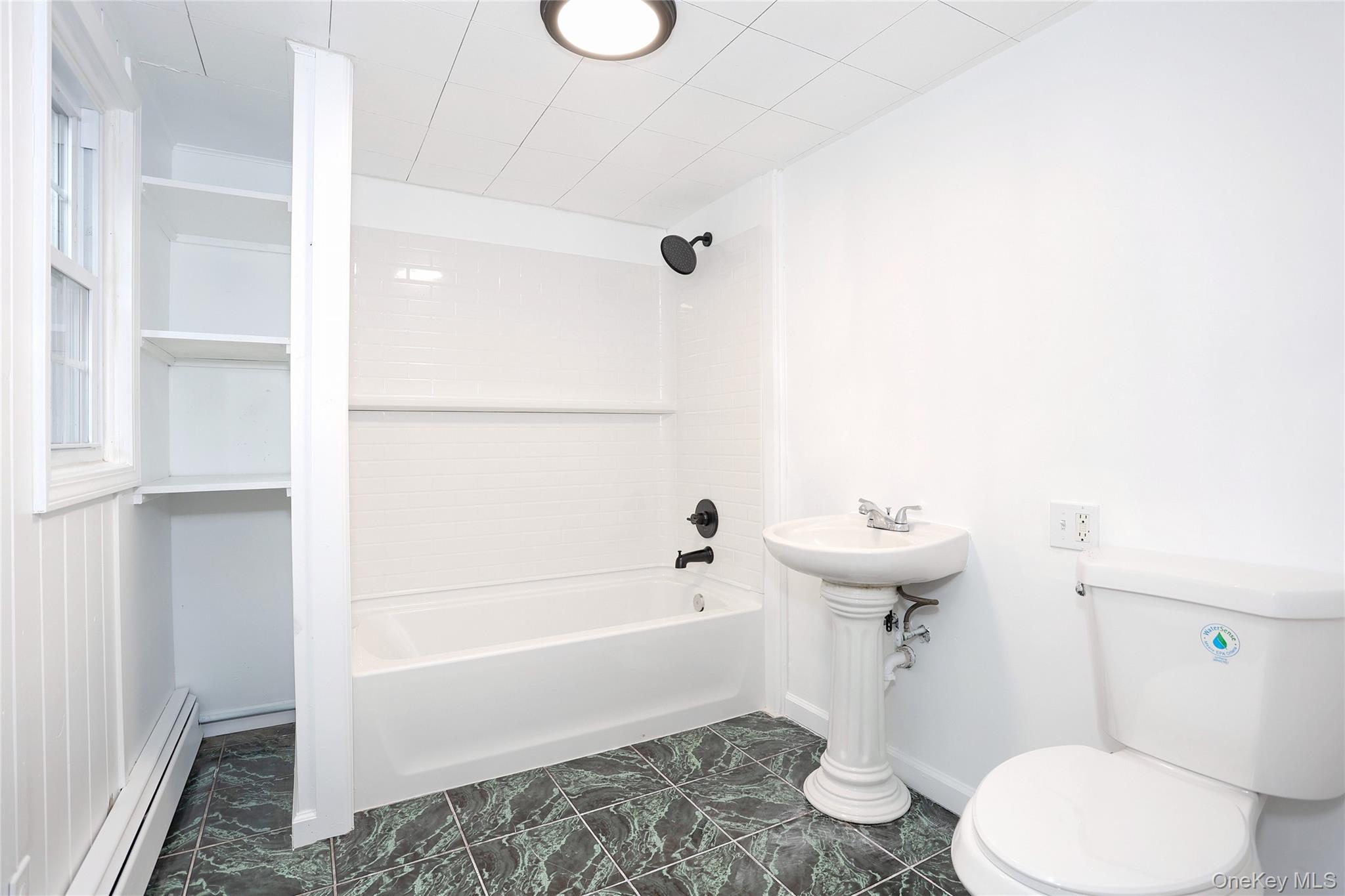 84 Pine Hill Road Chester, NY 10918 - Photo 14 of 18 Bathroom featuring baseboard heating and washtub / shower combination