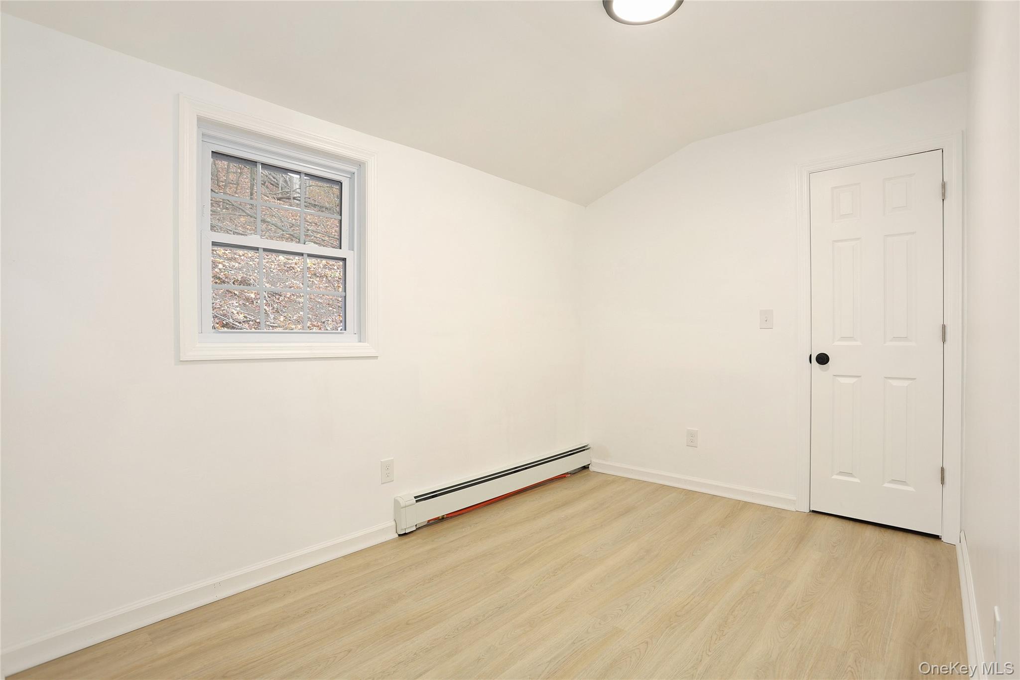 84 Pine Hill Road Chester, NY 10918 - Photo 16 of 18 Bedroom-2 with lofted ceiling, light wood-style floors, and a baseboard radiator