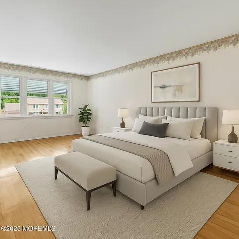a spacious bedroom with a bed and window