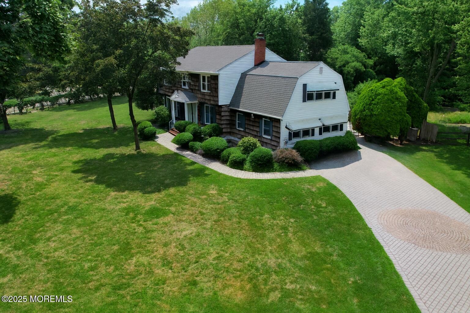 32 Woods Road Freehold, NJ 07728 - Photo 2 of 35 a front view of a house with garden