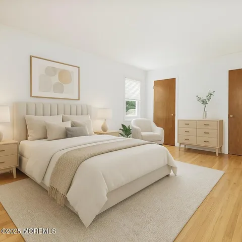 a bedroom with a bed and a lamp