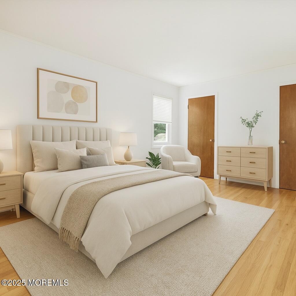 32 Woods Road Freehold, NJ 07728 - Photo 24 of 35 a bedroom with a bed and a lamp