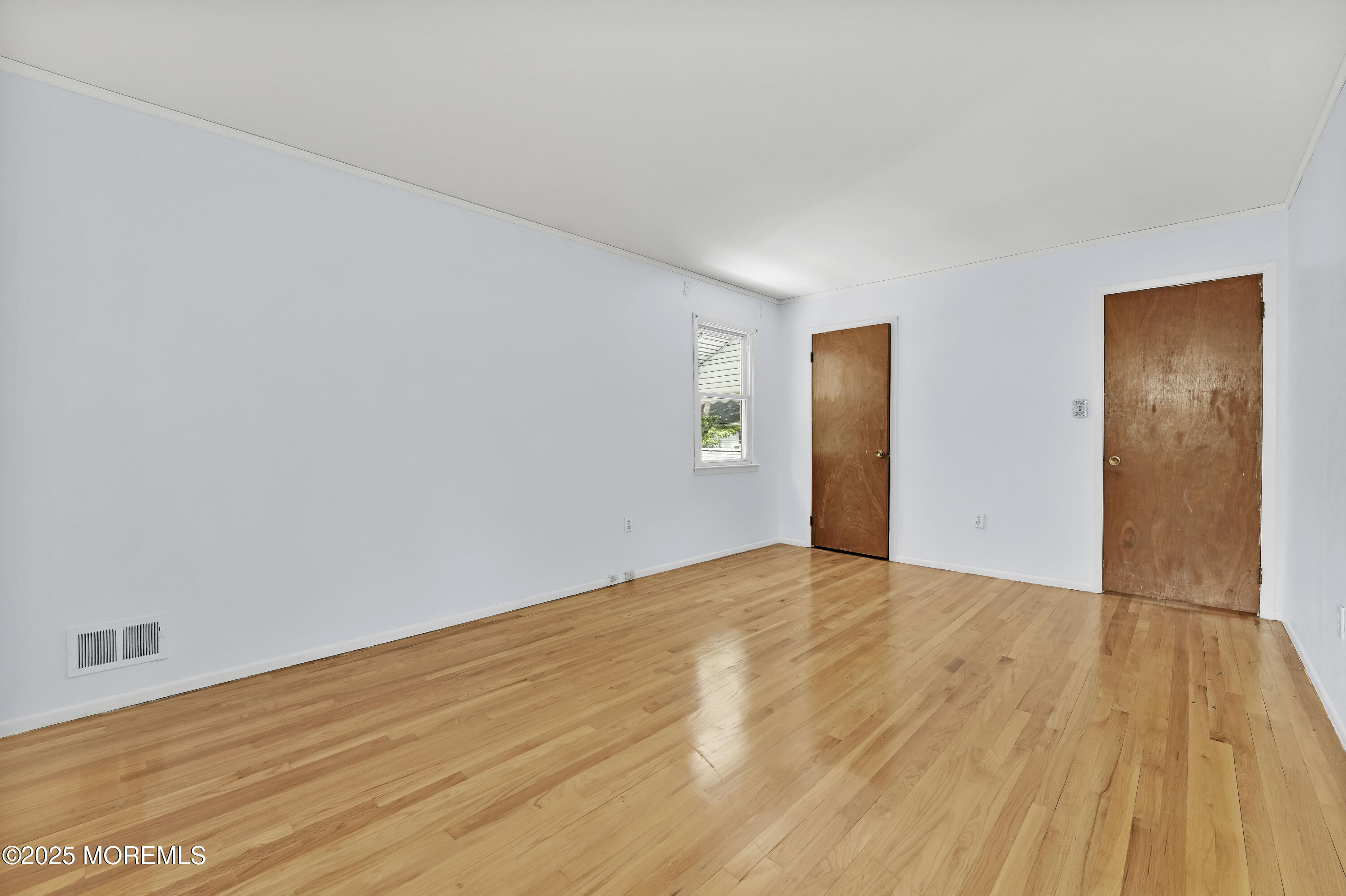 32 Woods Road Freehold, NJ 07728 - Photo 25 of 35 a view of an empty room and wooden floor