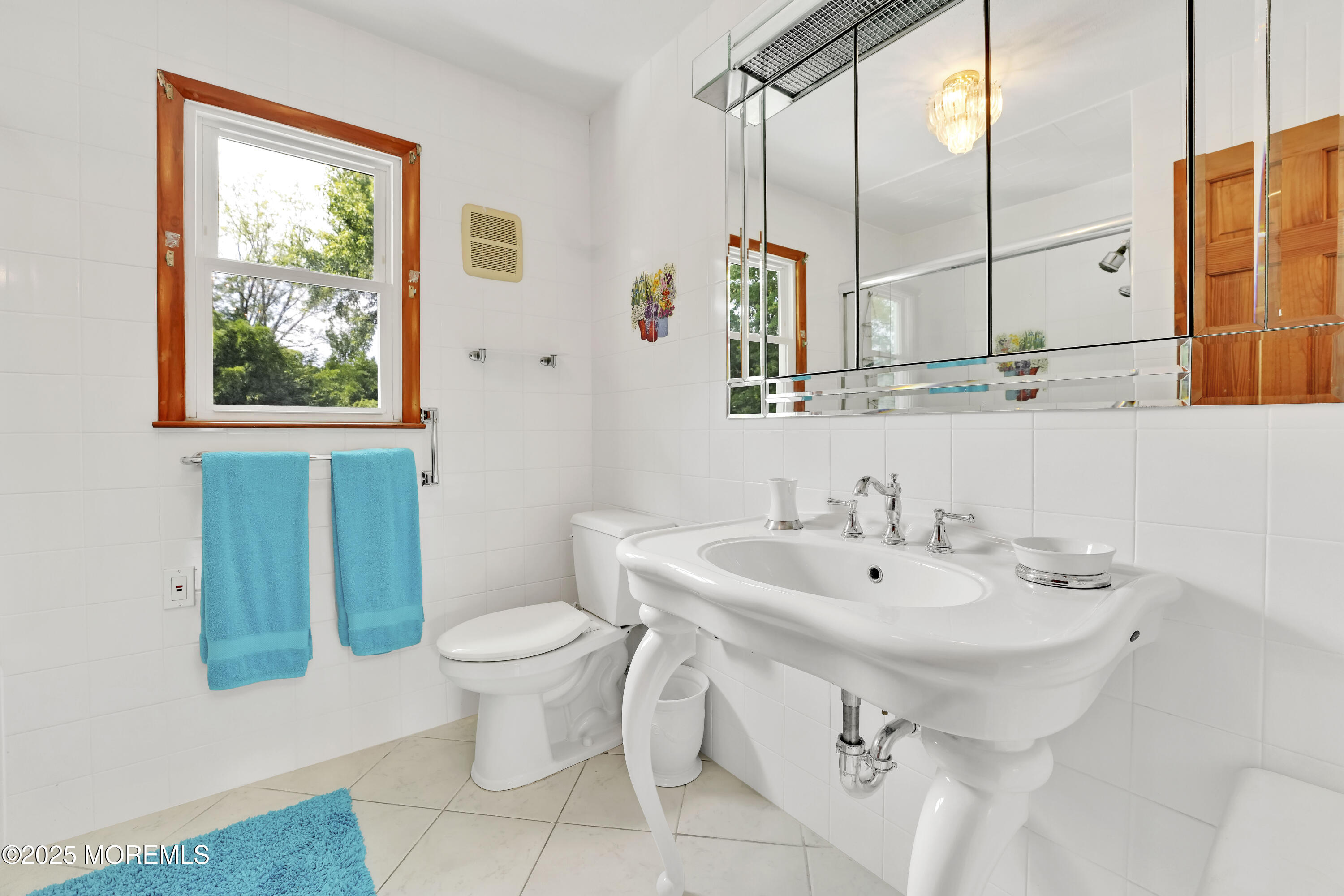 32 Woods Road Freehold, NJ 07728 - Photo 30 of 35 a bathroom with a sink and a mirror