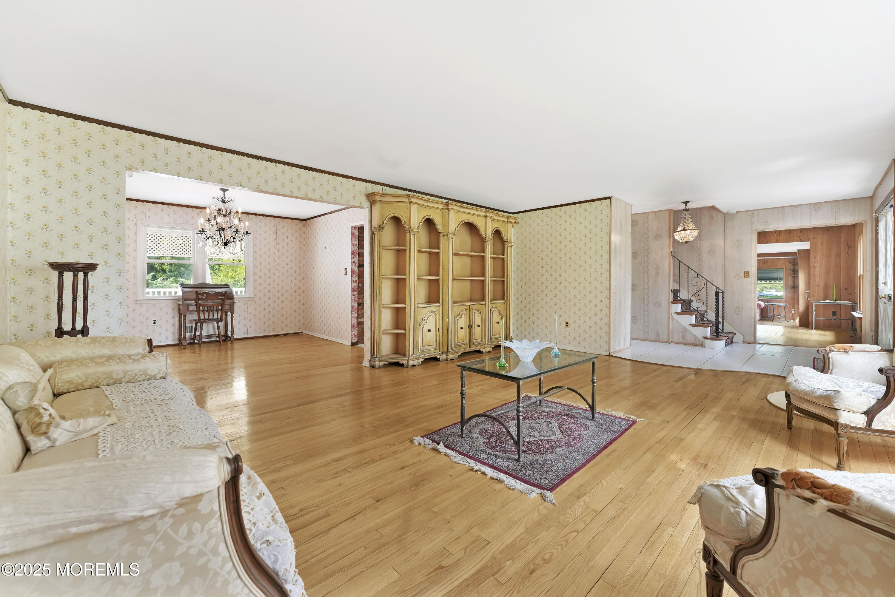 32 Woods Road Freehold, NJ 07728 - Photo 3 of 35 a living room with furniture and wooden floor