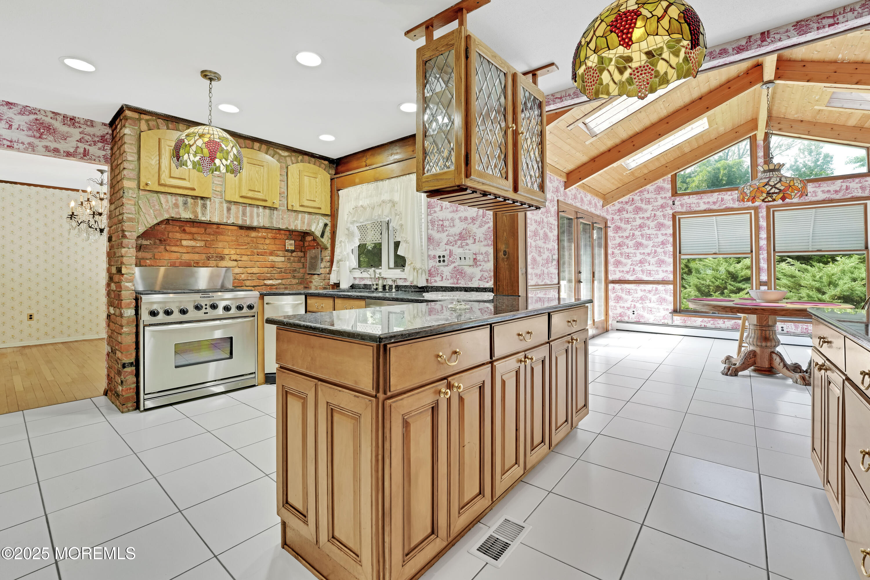 32 Woods Road Freehold, NJ 07728 - Photo 8 of 35 a kitchen with stainless steel appliances granite countertop a stove a sink and a microwave