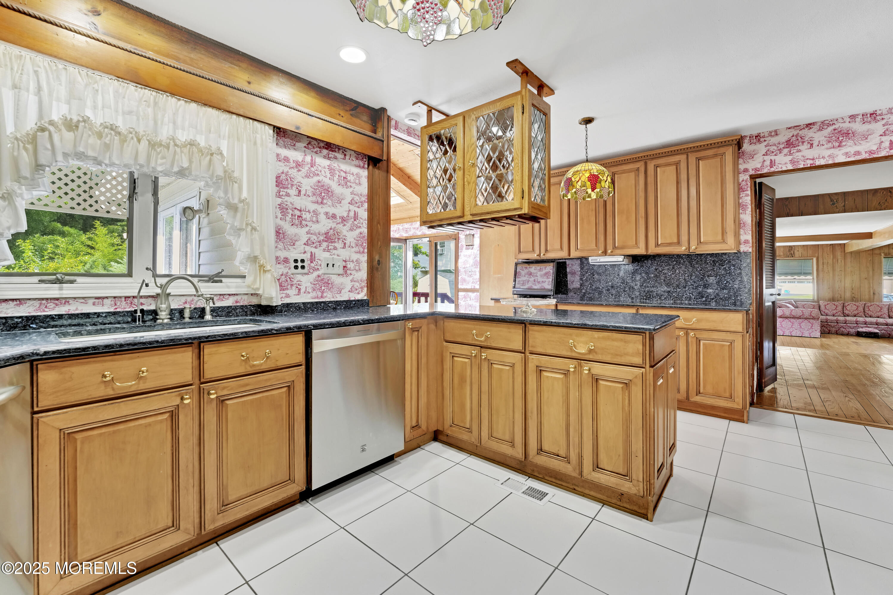 32 Woods Road Freehold, NJ 07728 - Photo 9 of 35 a kitchen with stainless steel appliances granite countertop a sink and cabinets