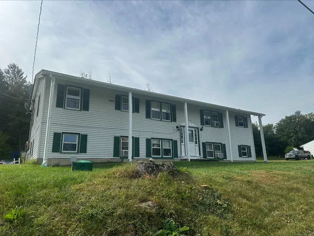 a house view with a garden space