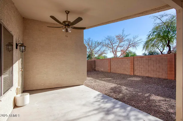 a view of yellow house with a yard