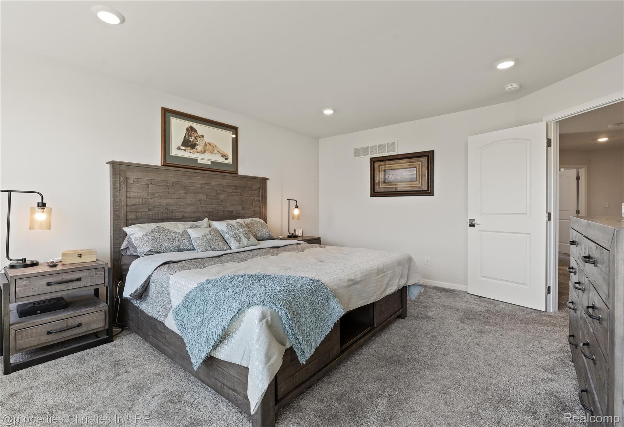 2721 Maize Loop Saline, MI 48176 - Photo 18 of 52 Carpeted bedroom with recessed lighting and baseboards