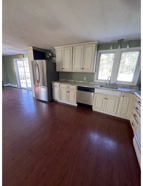 7 Butler Road Wilbraham, MA 01095 - Photo 5 of 9 a large kitchen with hardwood floor and a window