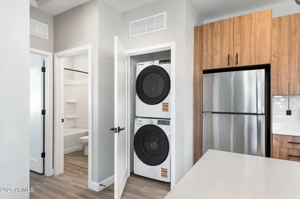 a view of a kitchen with washer and dryer