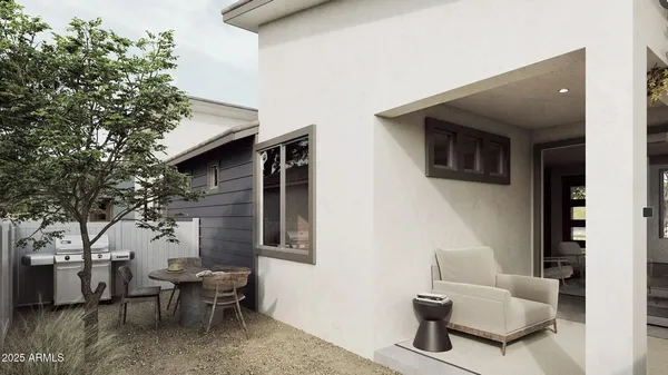 a living room with furniture and a potted plant