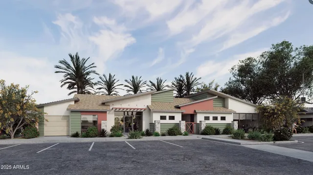 a front view of a house with a garden and trees