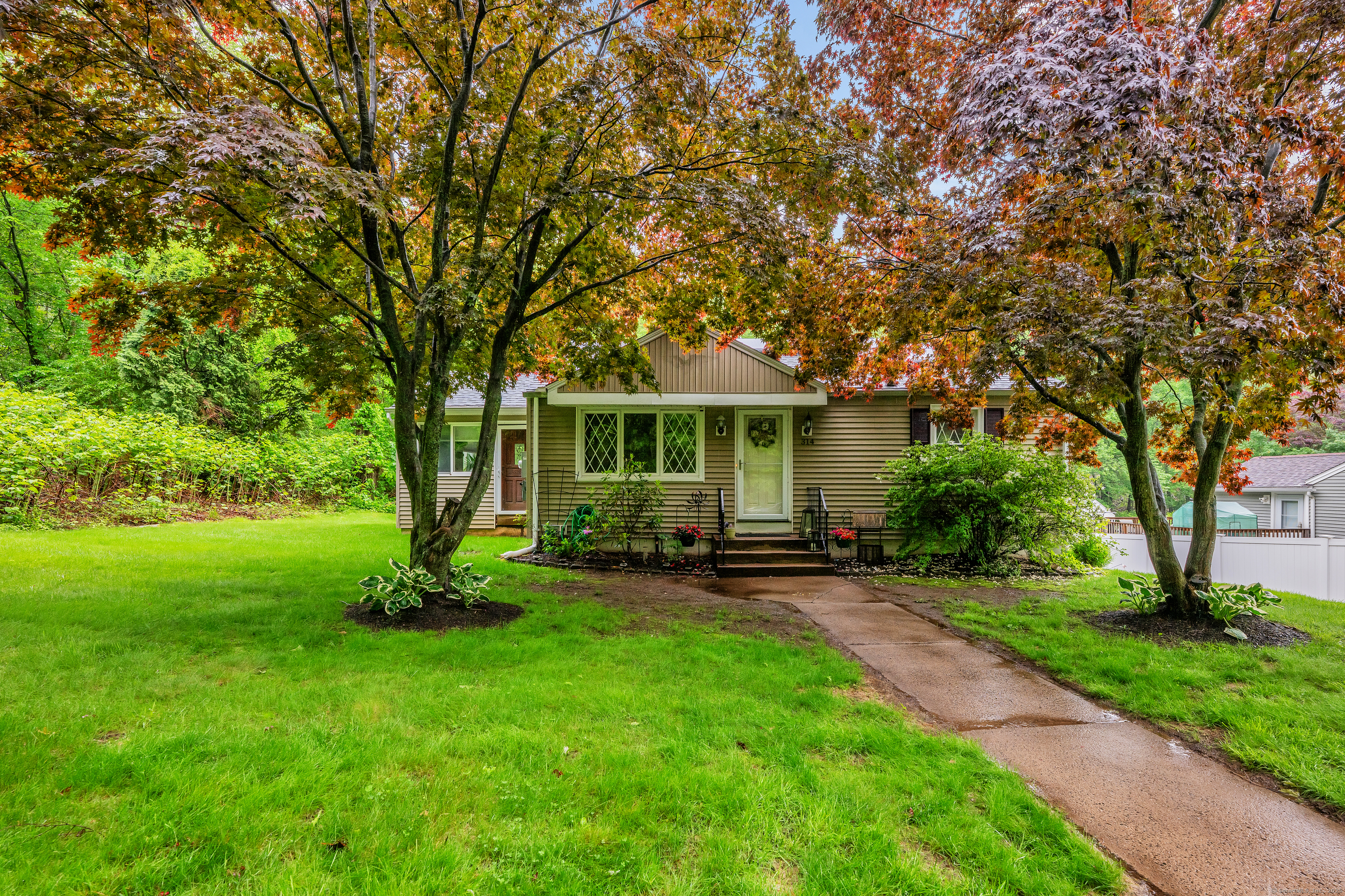 314 Old Wolcott Road Bristol, CT 06010 - Photo 1 of 1 a view of a house with backyard garden and sitting area
