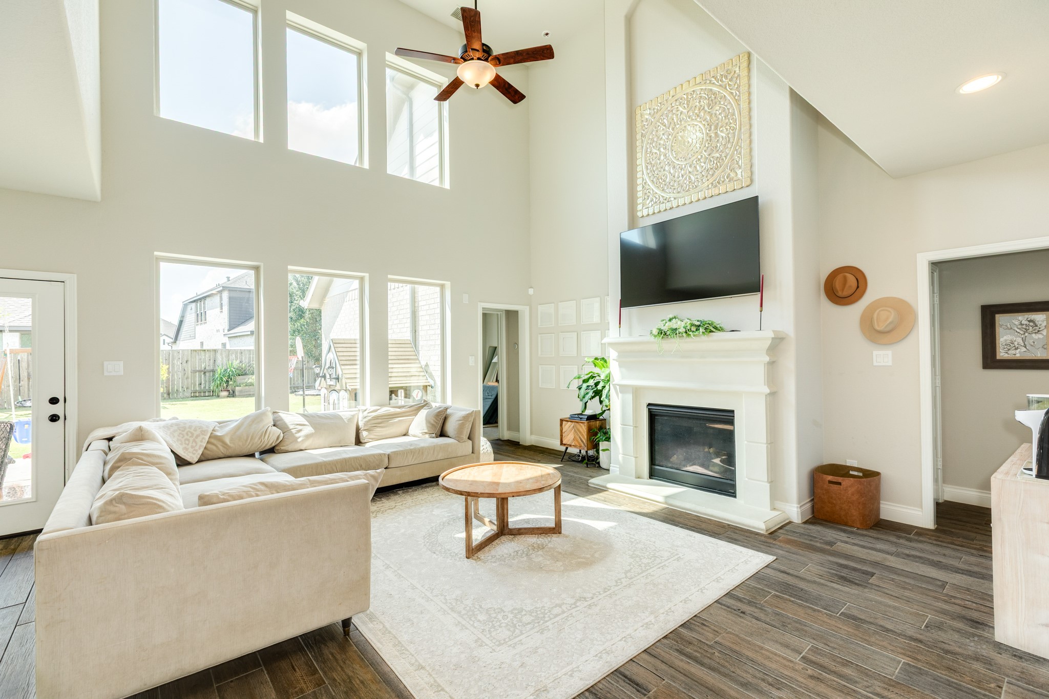 3706 Arpa Street Rosharon, TX 77583 - Photo 50 of 50 a living room with furniture a fireplace and a flat screen tv