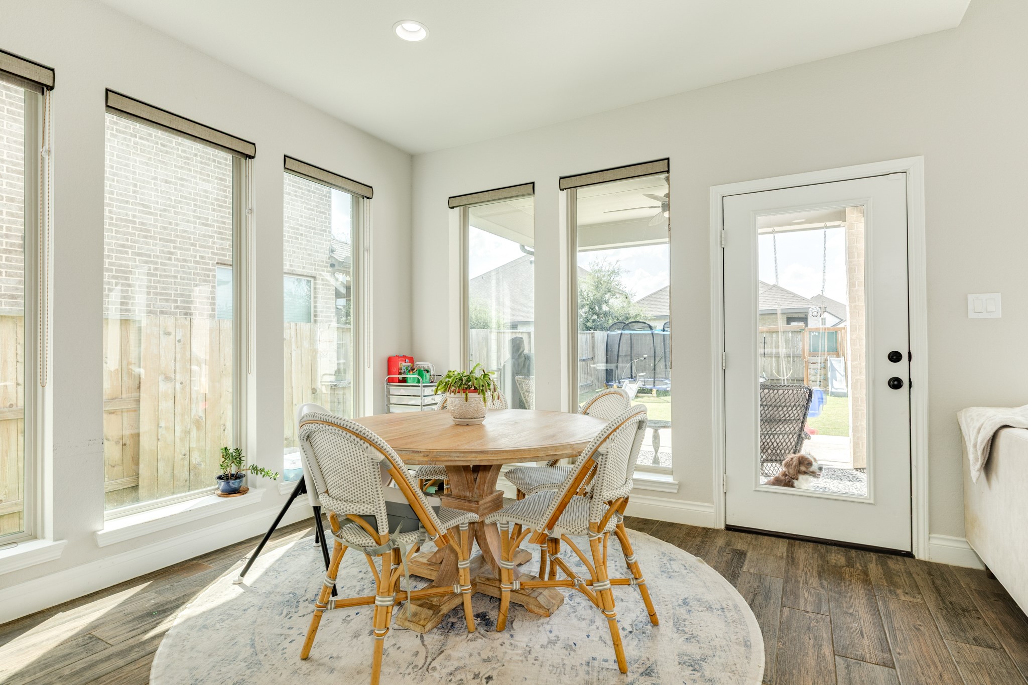 3706 Arpa Street Rosharon, TX 77583 - Photo 13 of 50 a view of a dining room with furniture and wooden floor