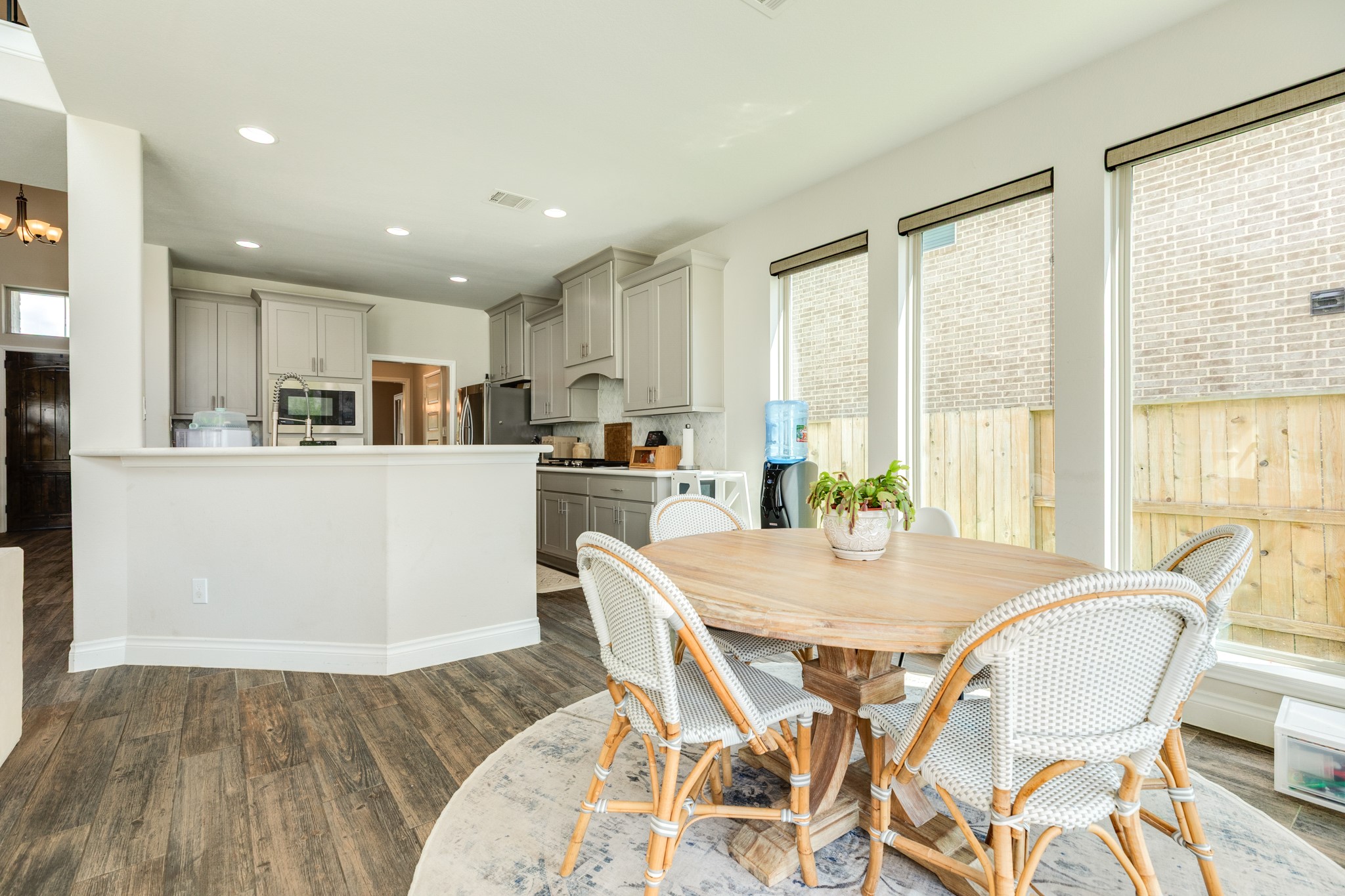3706 Arpa Street Rosharon, TX 77583 - Photo 14 of 50 a view of a dining room with furniture large windows and wooden floor