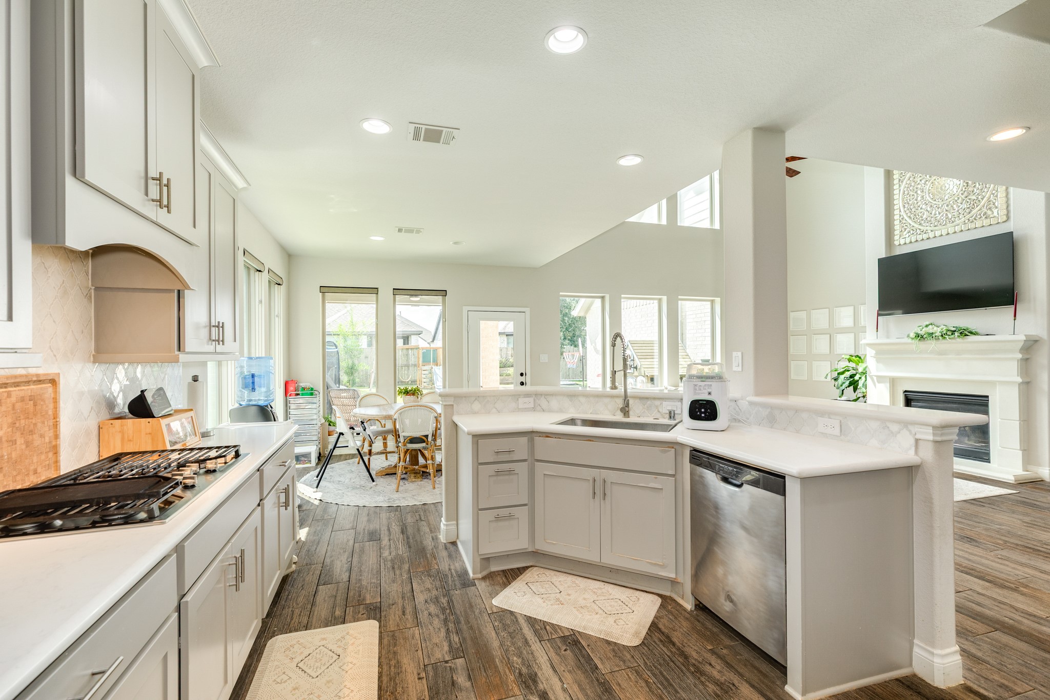 3706 Arpa Street Rosharon, TX 77583 - Photo 16 of 50 a kitchen with a sink stove and cabinets