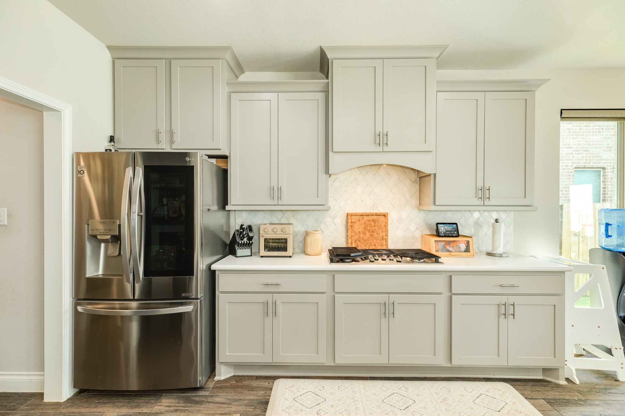 3706 Arpa Street Rosharon, TX 77583 - Photo 17 of 50 a kitchen with stainless steel appliances granite countertop a refrigerator sink and cabinets
