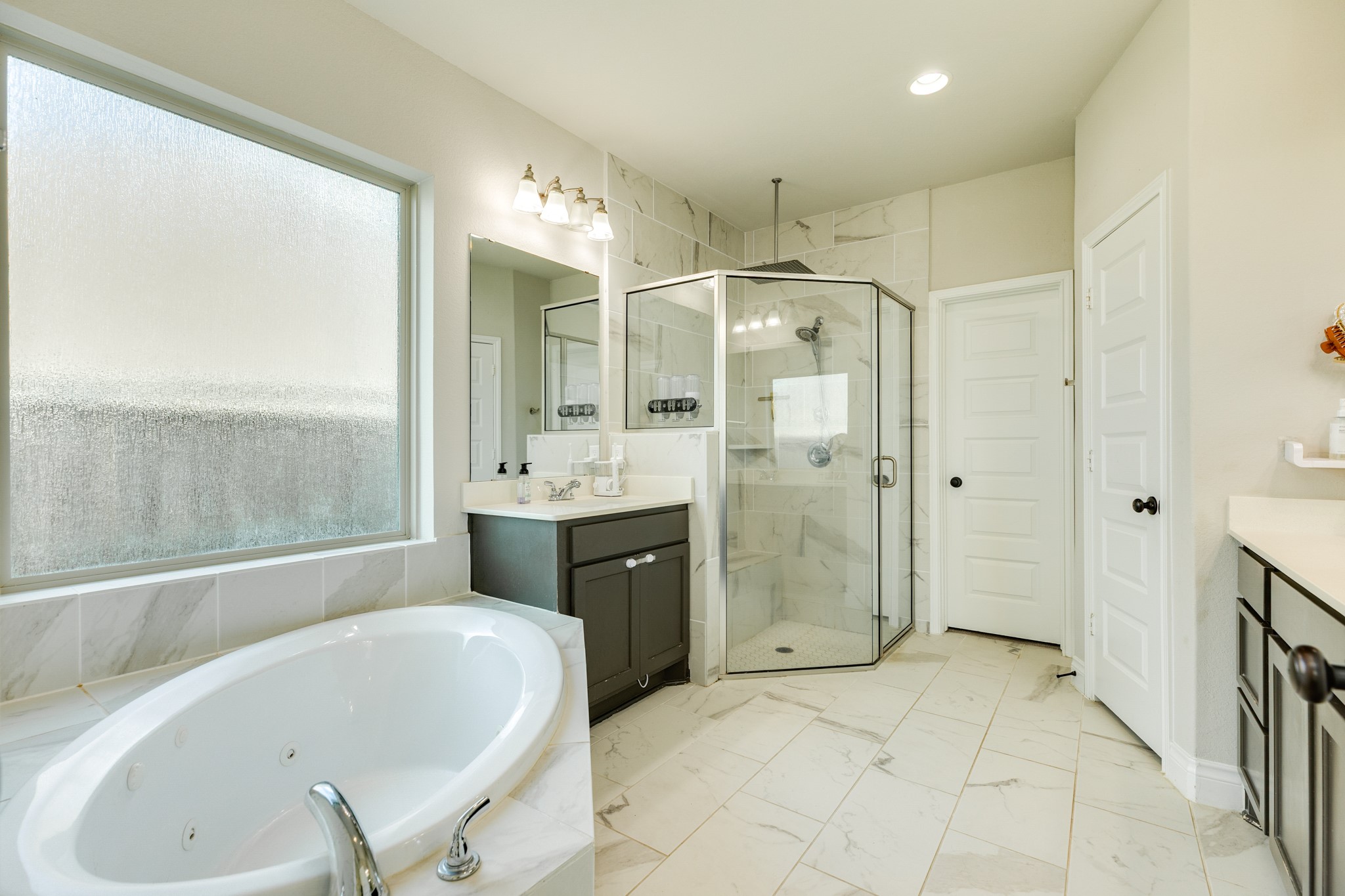 3706 Arpa Street Rosharon, TX 77583 - Photo 20 of 50 a bathroom with a tub sink shower and mirror