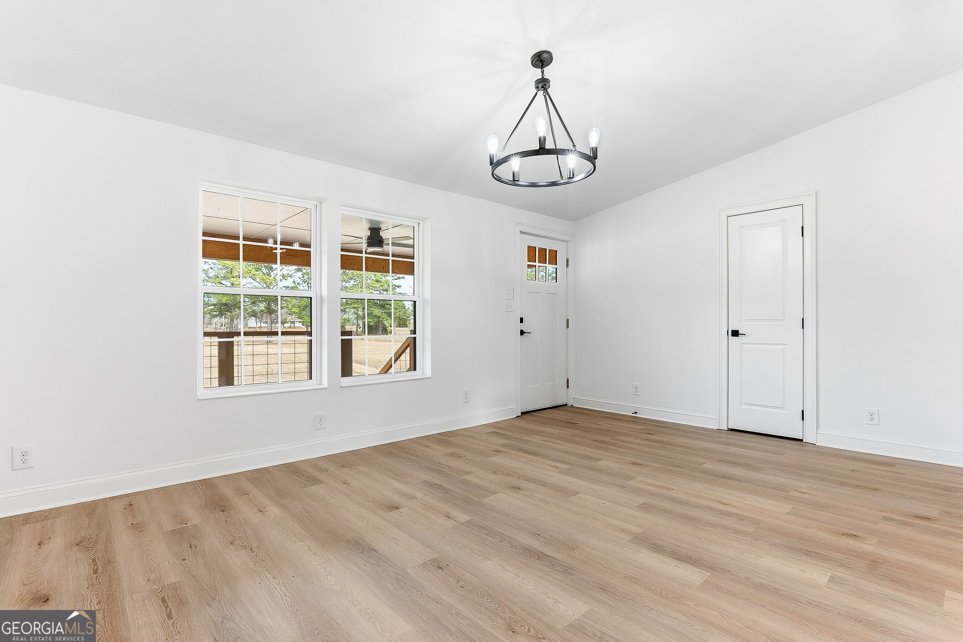 5393 Rogers Road Lizella, GA 31052 - Photo 16 of 52 a view of empty room with windows and ceiling fan