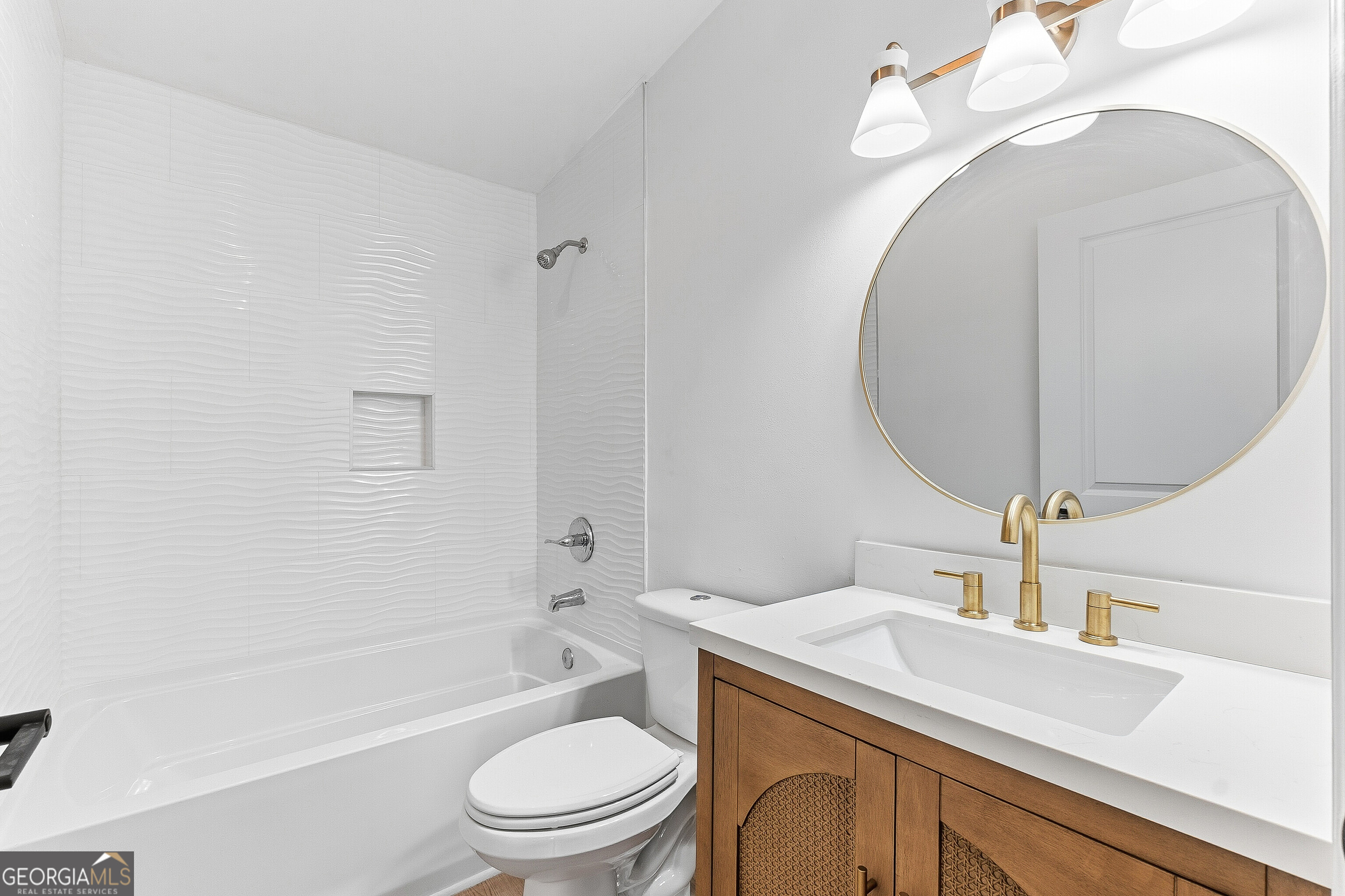 5393 Rogers Road Lizella, GA 31052 - Photo 19 of 52 a bathroom with a sink a toilet and shower