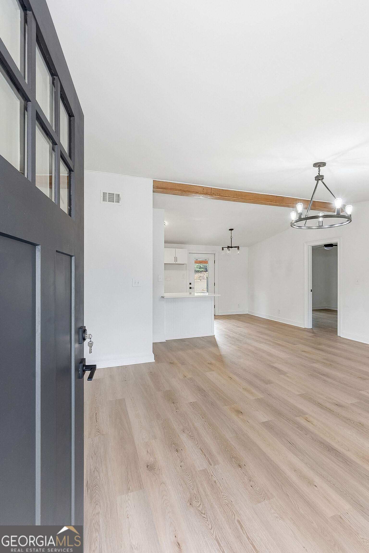5393 Rogers Road Lizella, GA 31052 - Photo 2 of 52 a view of a kitchen with a sink and a refrigerator