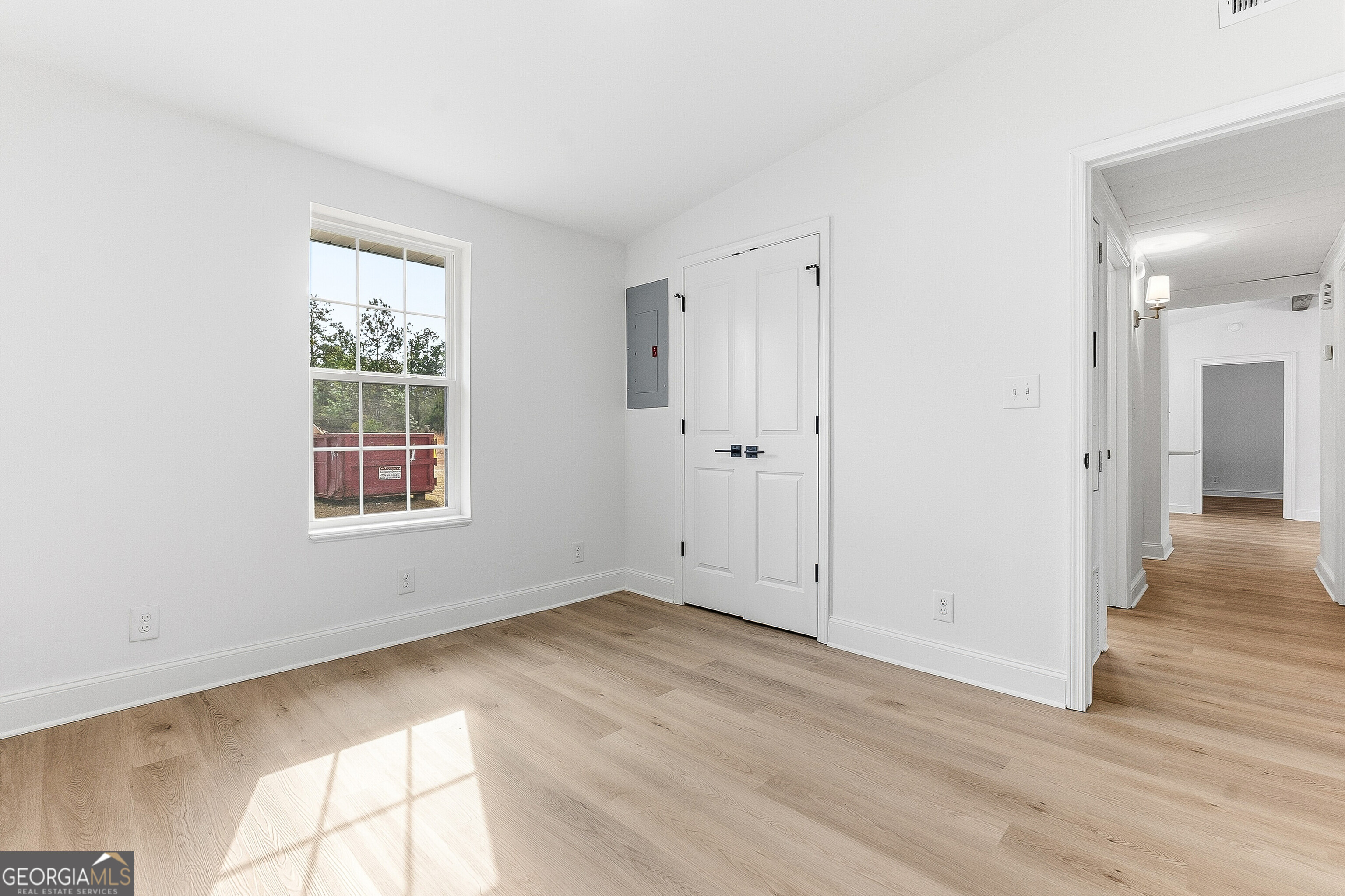 5393 Rogers Road Lizella, GA 31052 - Photo 21 of 52 an empty room with wooden floor and windows
