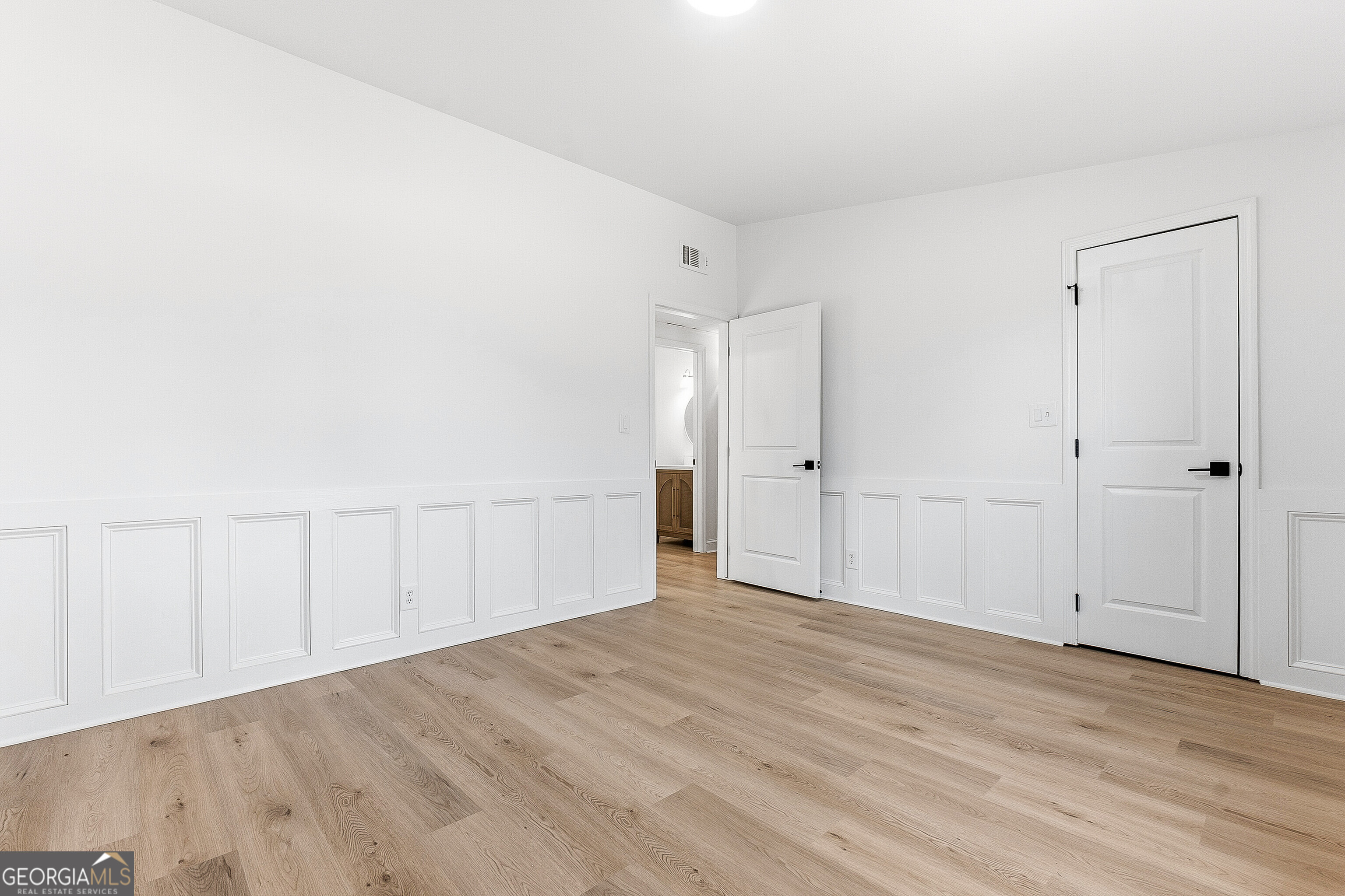 5393 Rogers Road Lizella, GA 31052 - Photo 23 of 52 a view of an empty room with wooden floor