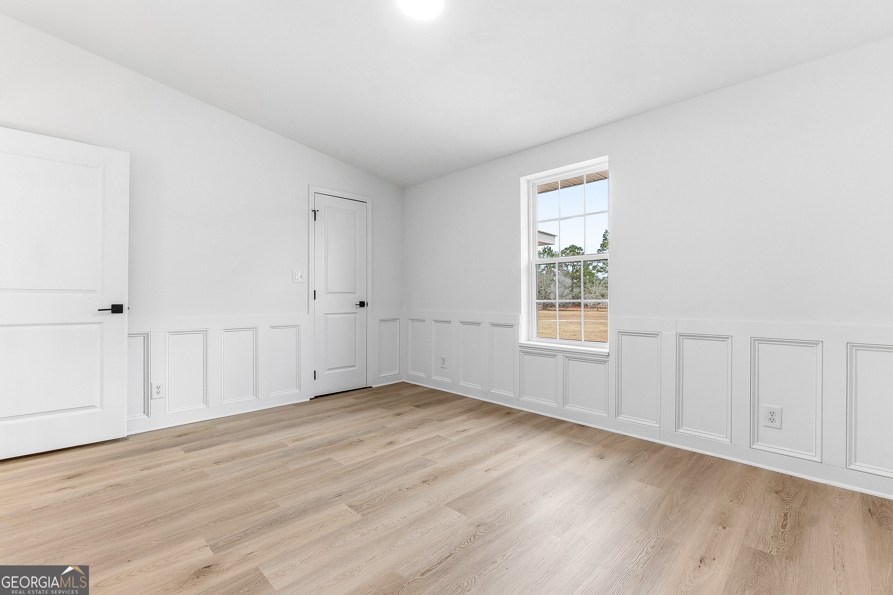 5393 Rogers Road Lizella, GA 31052 - Photo 24 of 52 a view of an empty room with wooden floor