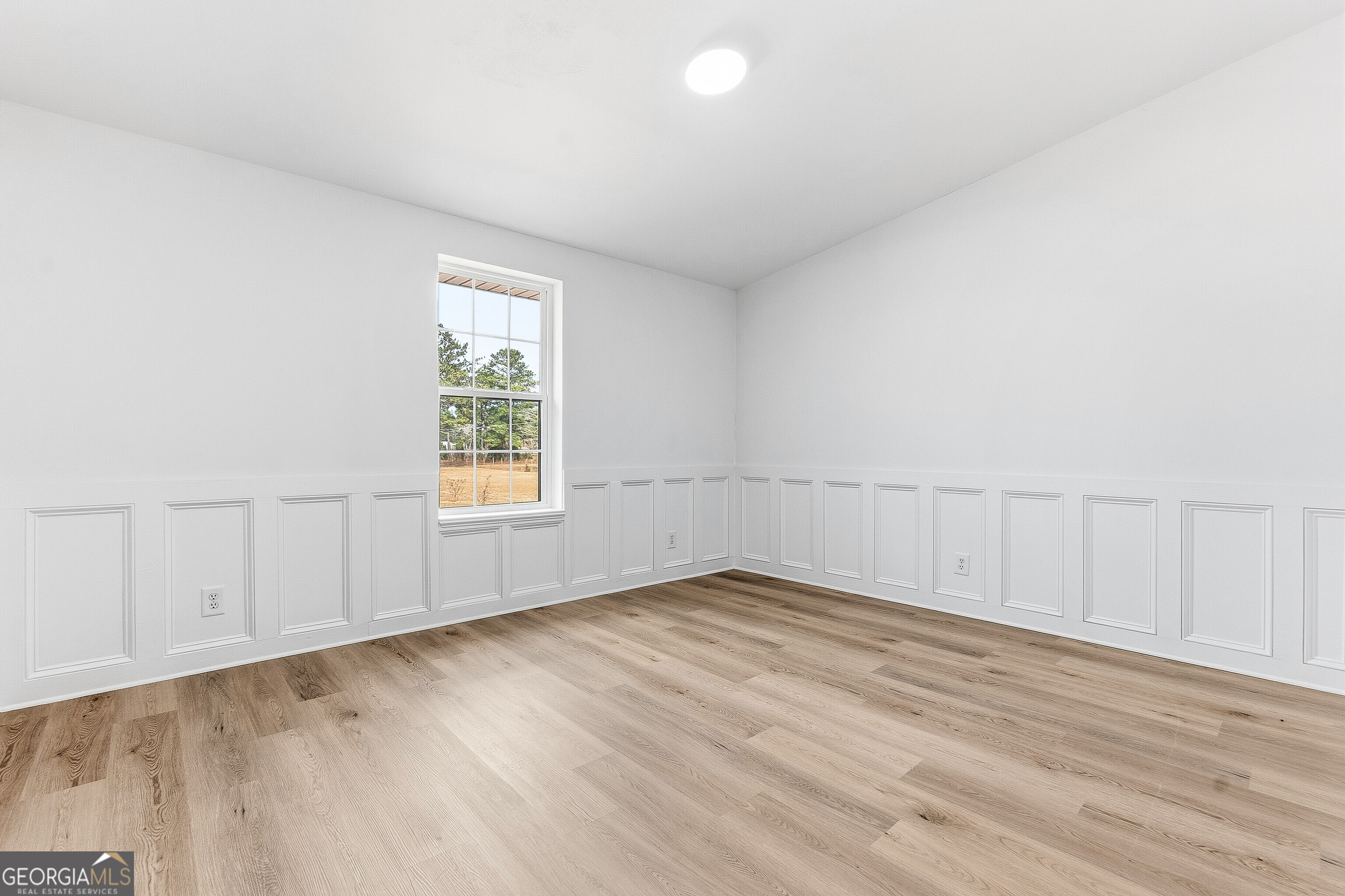 5393 Rogers Road Lizella, GA 31052 - Photo 25 of 52 an empty room with wooden floor and windows