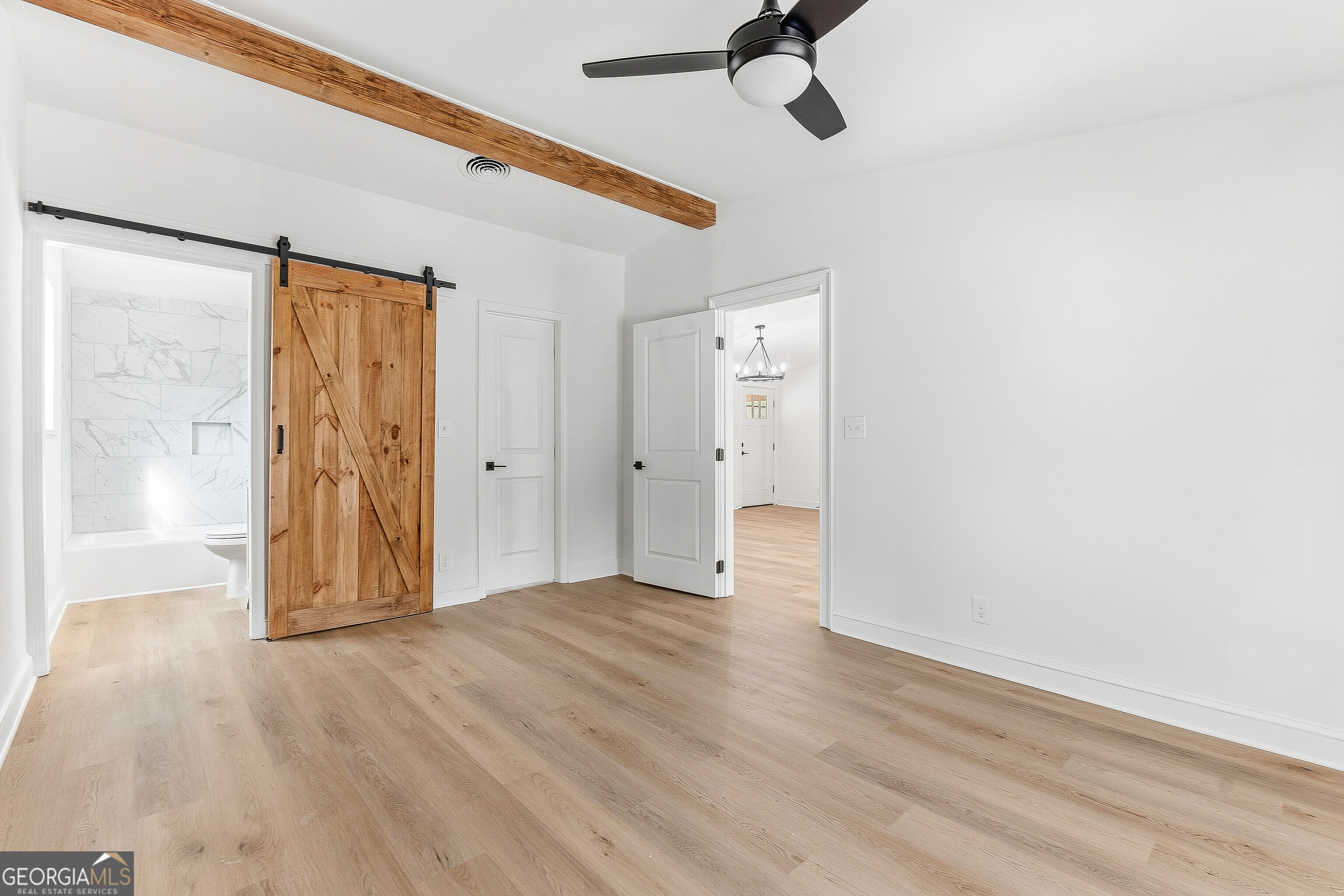 5393 Rogers Road Lizella, GA 31052 - Photo 30 of 52 a view of an empty room with wooden floor