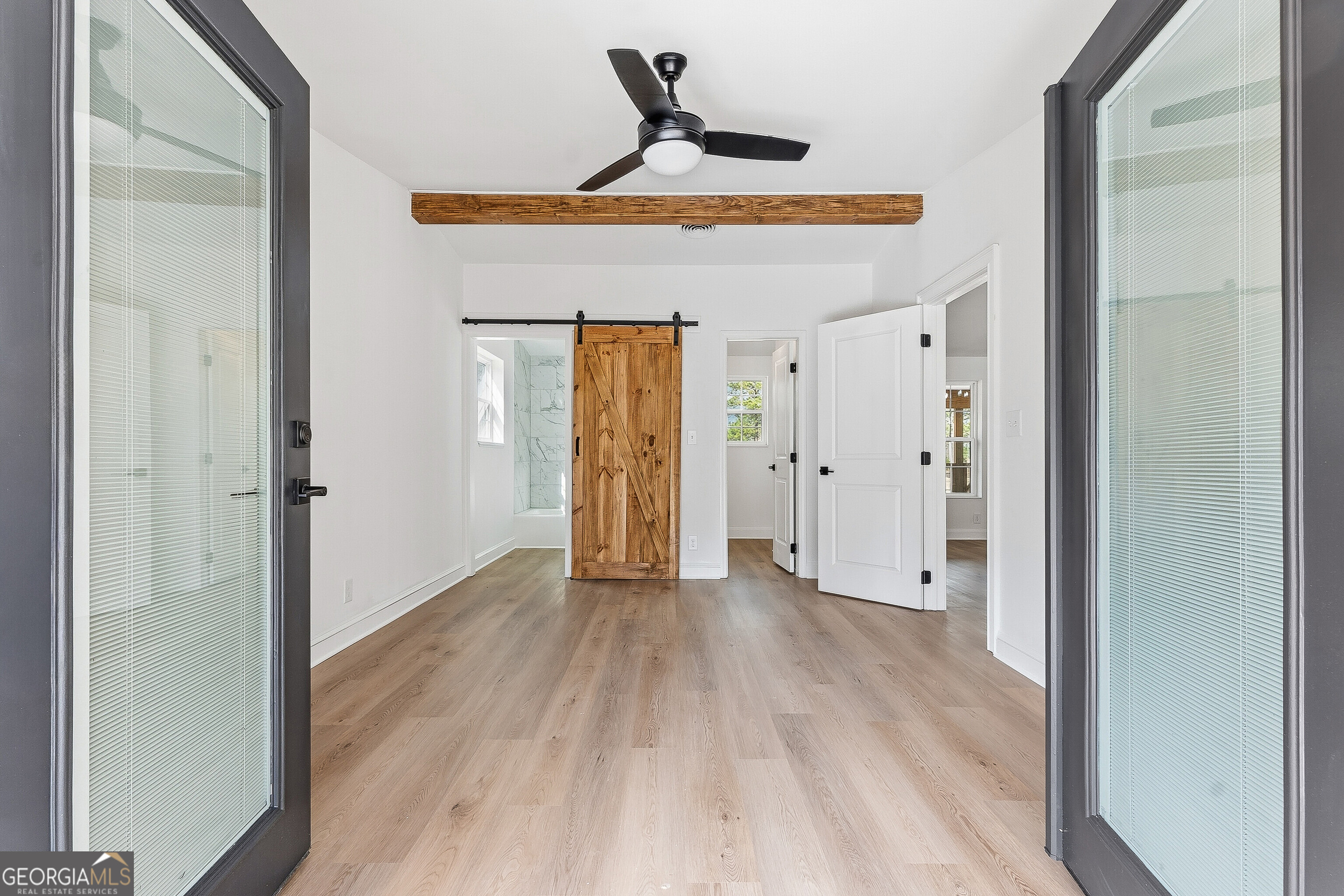 5393 Rogers Road Lizella, GA 31052 - Photo 33 of 52 a view of a hallway with wooden floor and closet