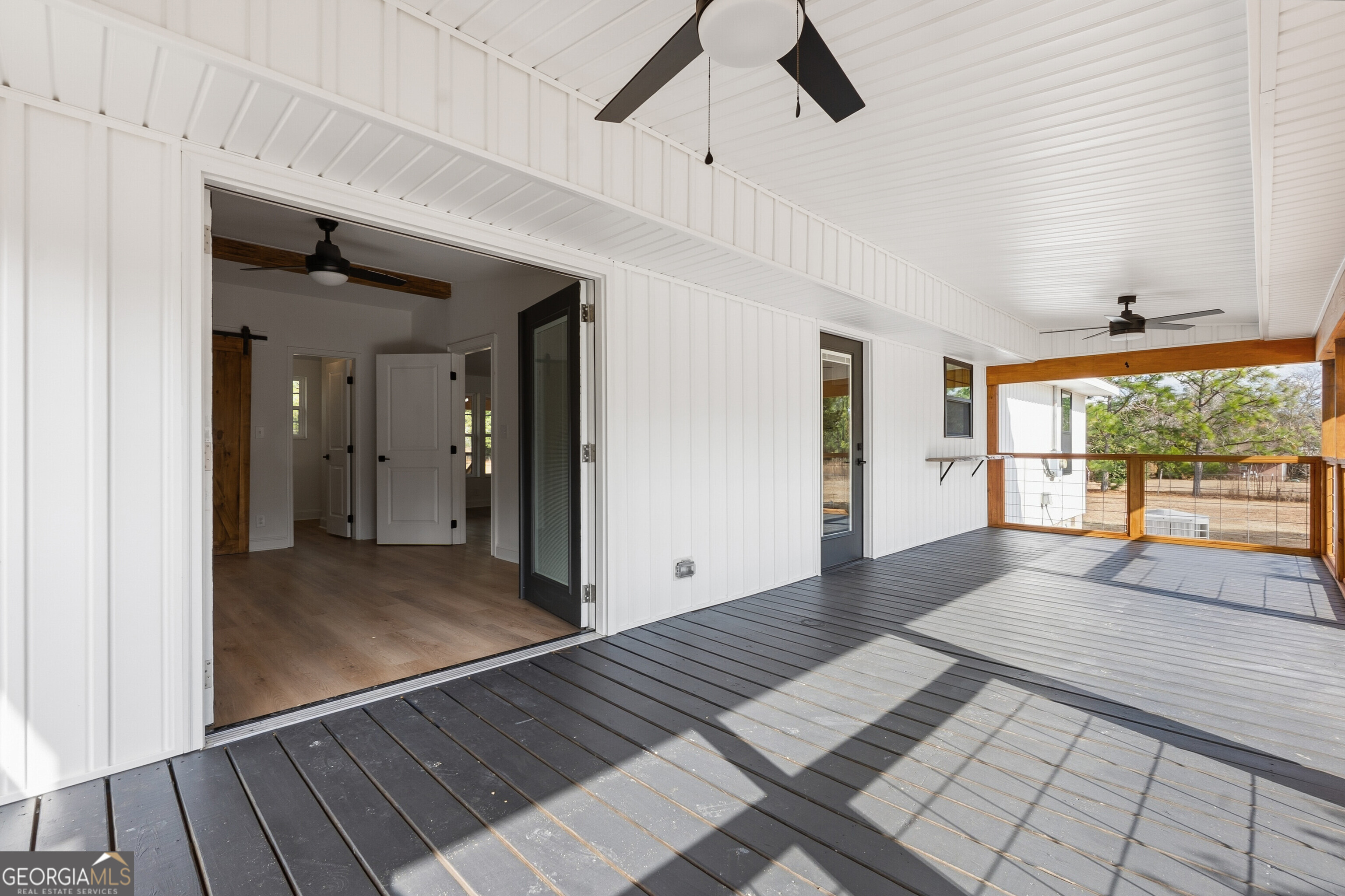 5393 Rogers Road Lizella, GA 31052 - Photo 34 of 52 a view of a hallway view with wooden floor and windows