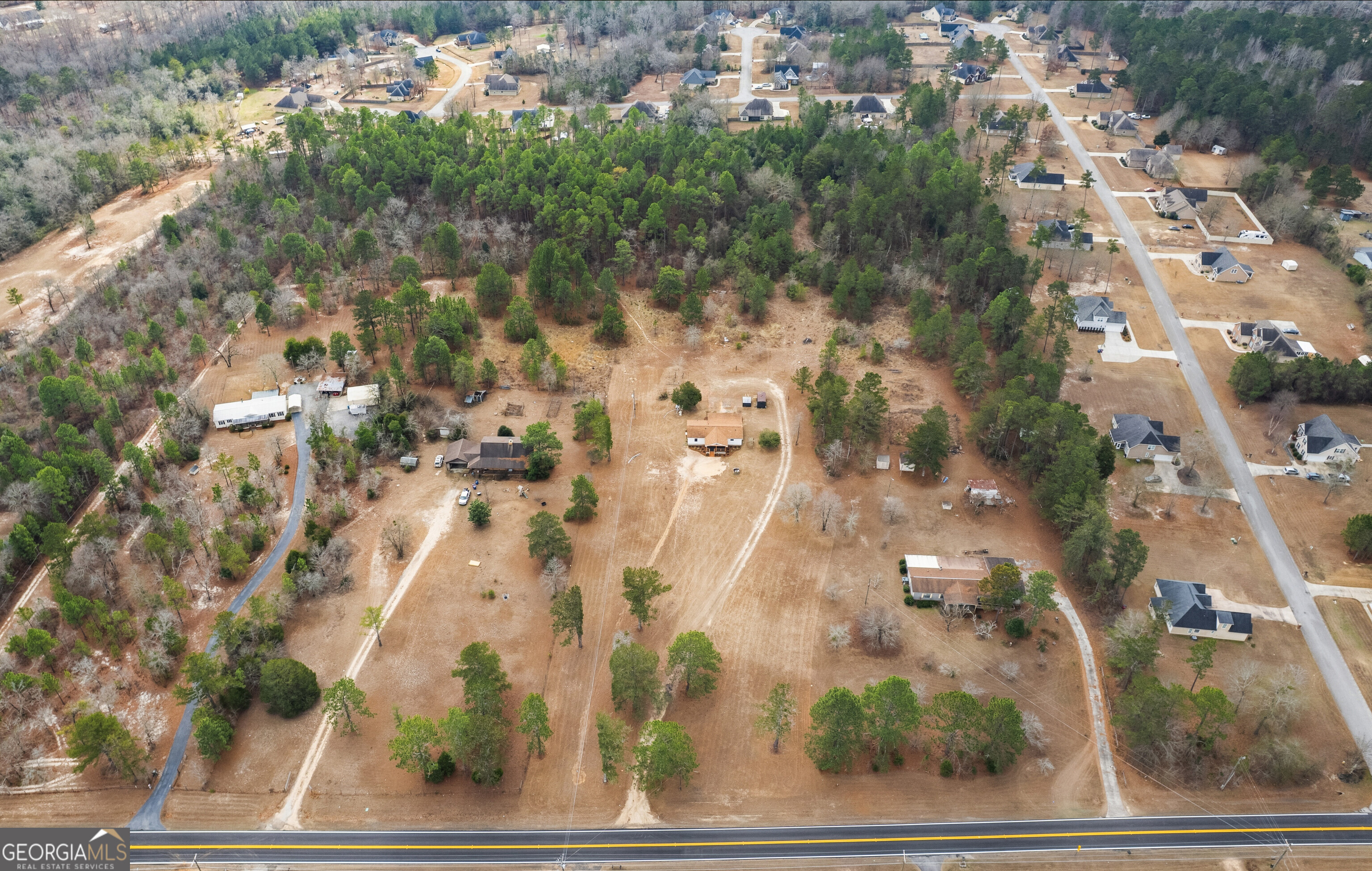 5393 Rogers Road Lizella, GA 31052 - Photo 44 of 52 an aerial view of residential houses with outdoor space