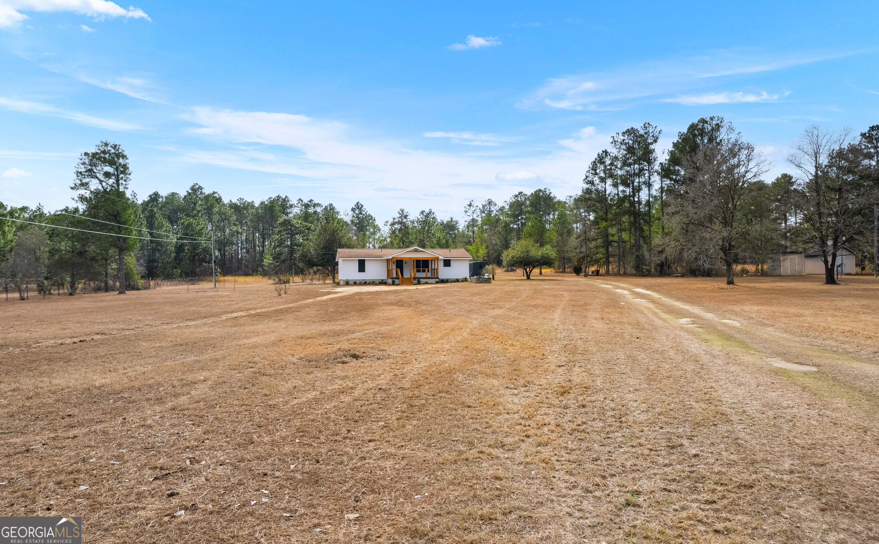 5393 Rogers Road Lizella, GA 31052 - Photo 51 of 52 a view of outdoor space with trees all around