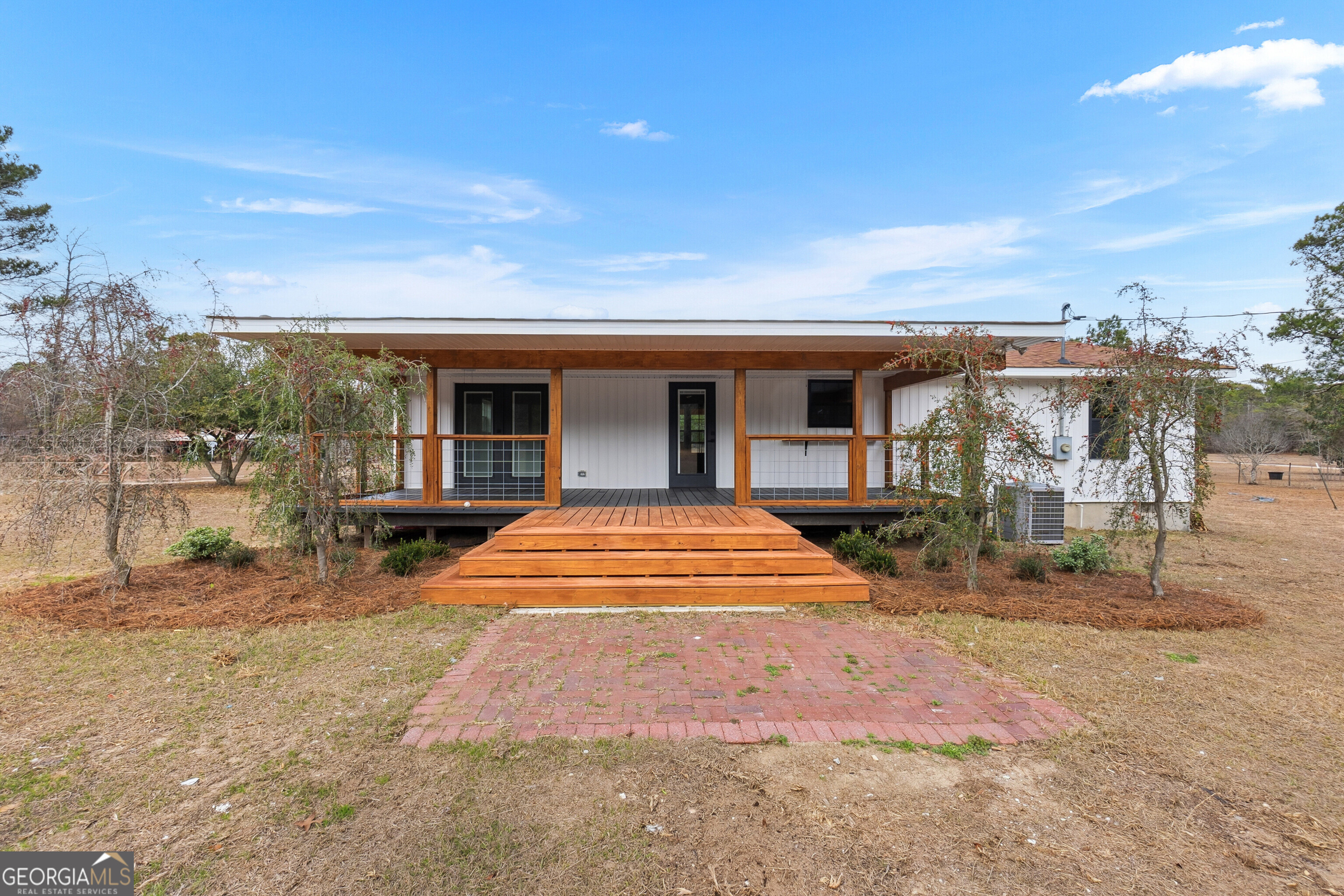 5393 Rogers Road Lizella, GA 31052 - Photo 52 of 52 a view of a house with backyard porch and sitting area
