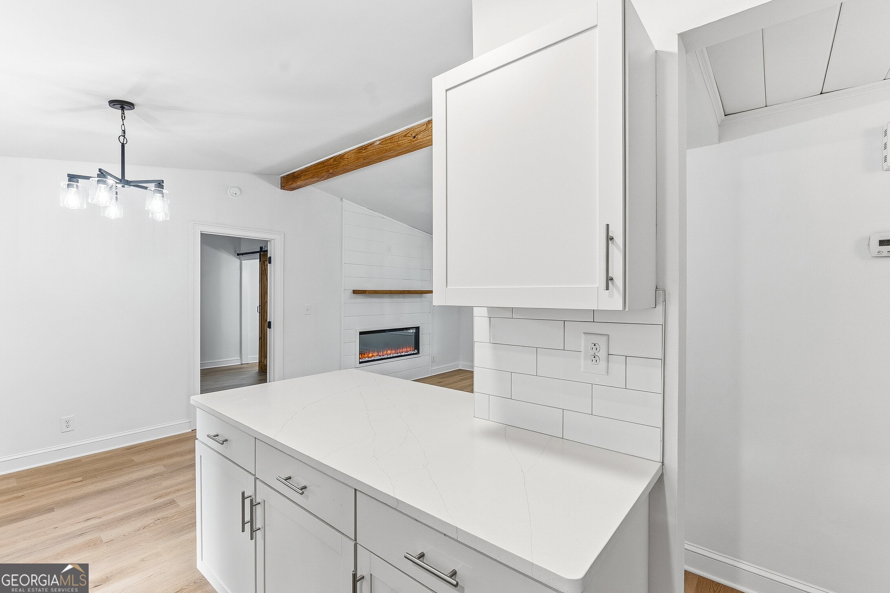 5393 Rogers Road Lizella, GA 31052 - Photo 6 of 52 a kitchen with granite countertop white cabinets and white appliances