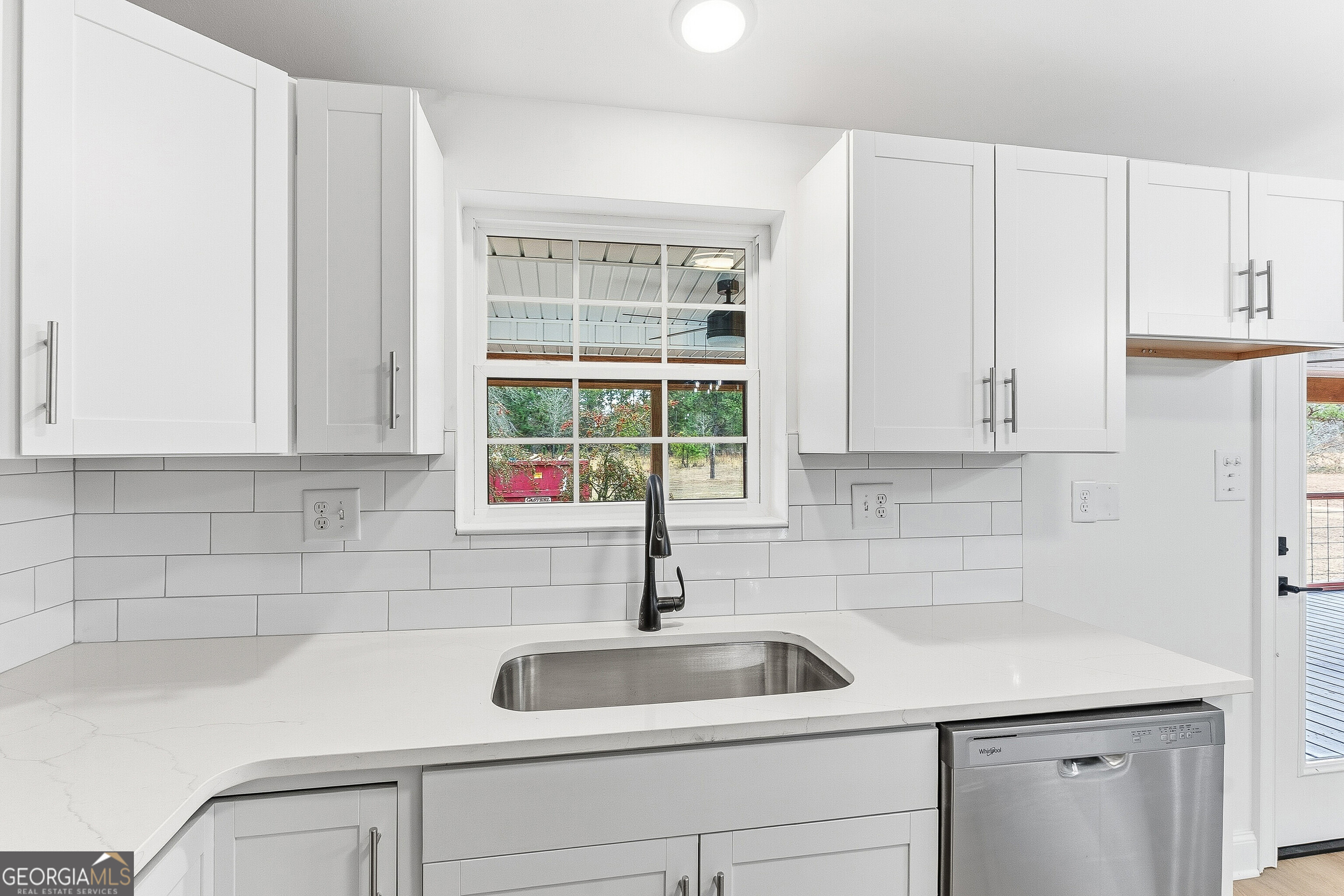 5393 Rogers Road Lizella, GA 31052 - Photo 7 of 52 a kitchen with white cabinets and a sink