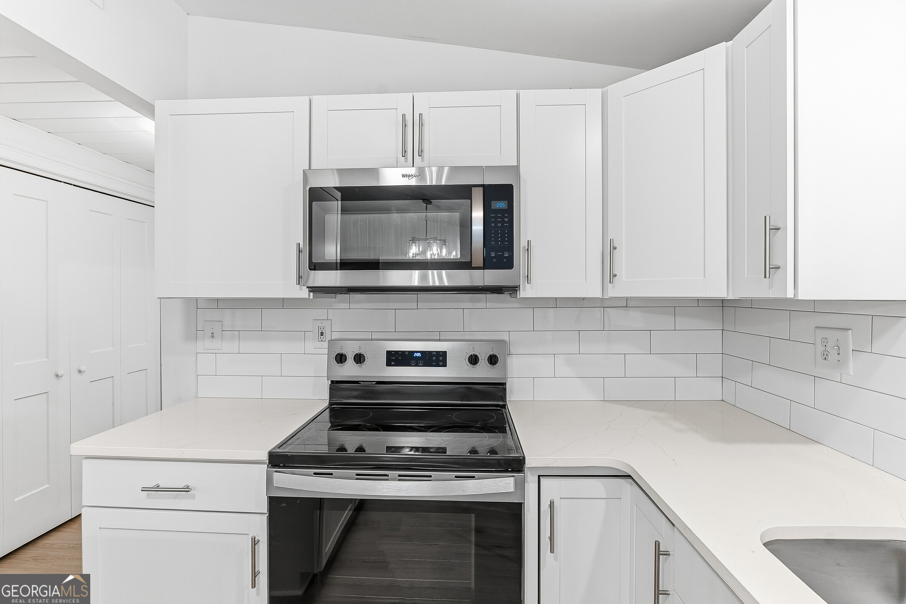 5393 Rogers Road Lizella, GA 31052 - Photo 8 of 52 a kitchen with appliances a sink and cabinets