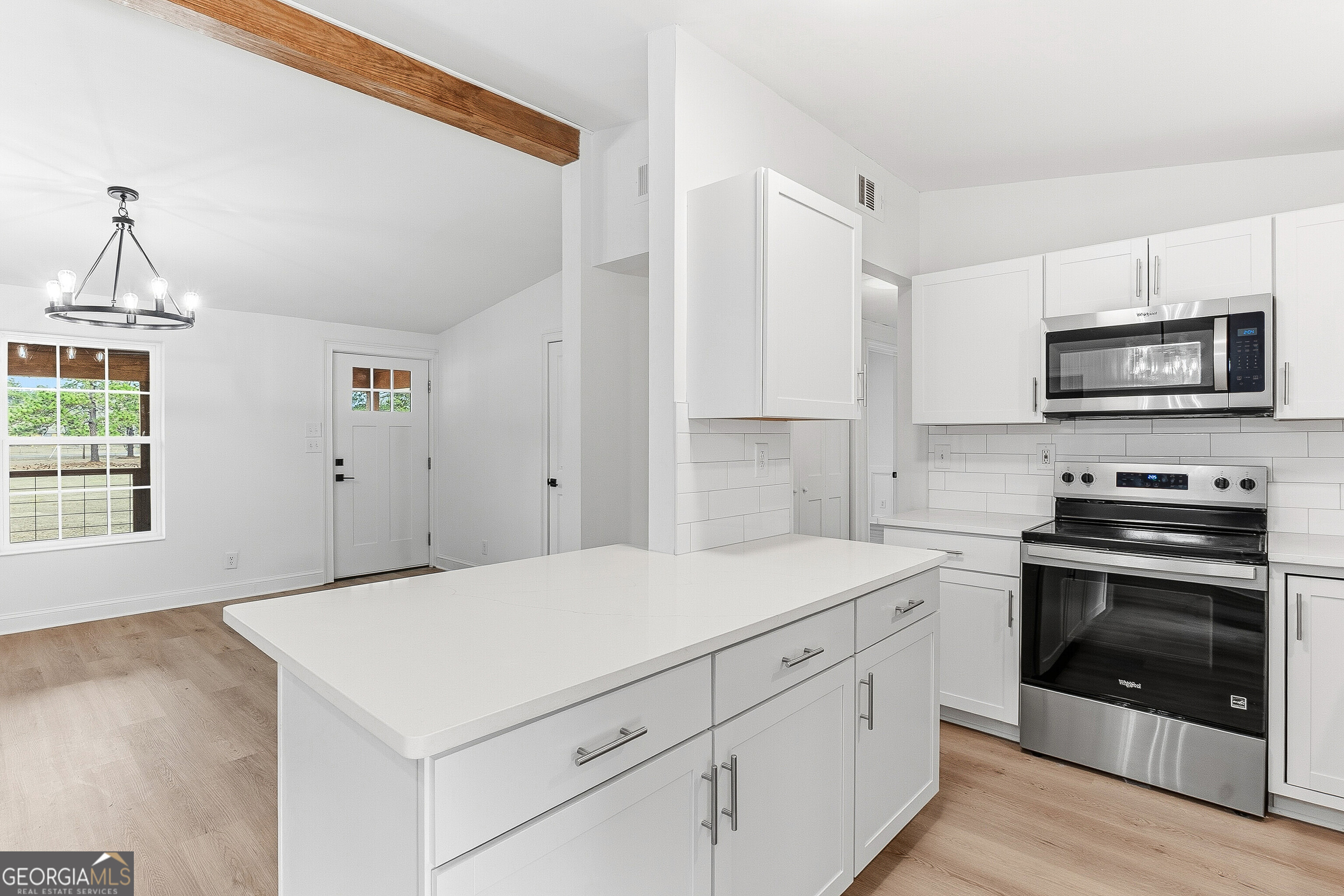 5393 Rogers Road Lizella, GA 31052 - Photo 10 of 52 a kitchen with a stove and a microwave