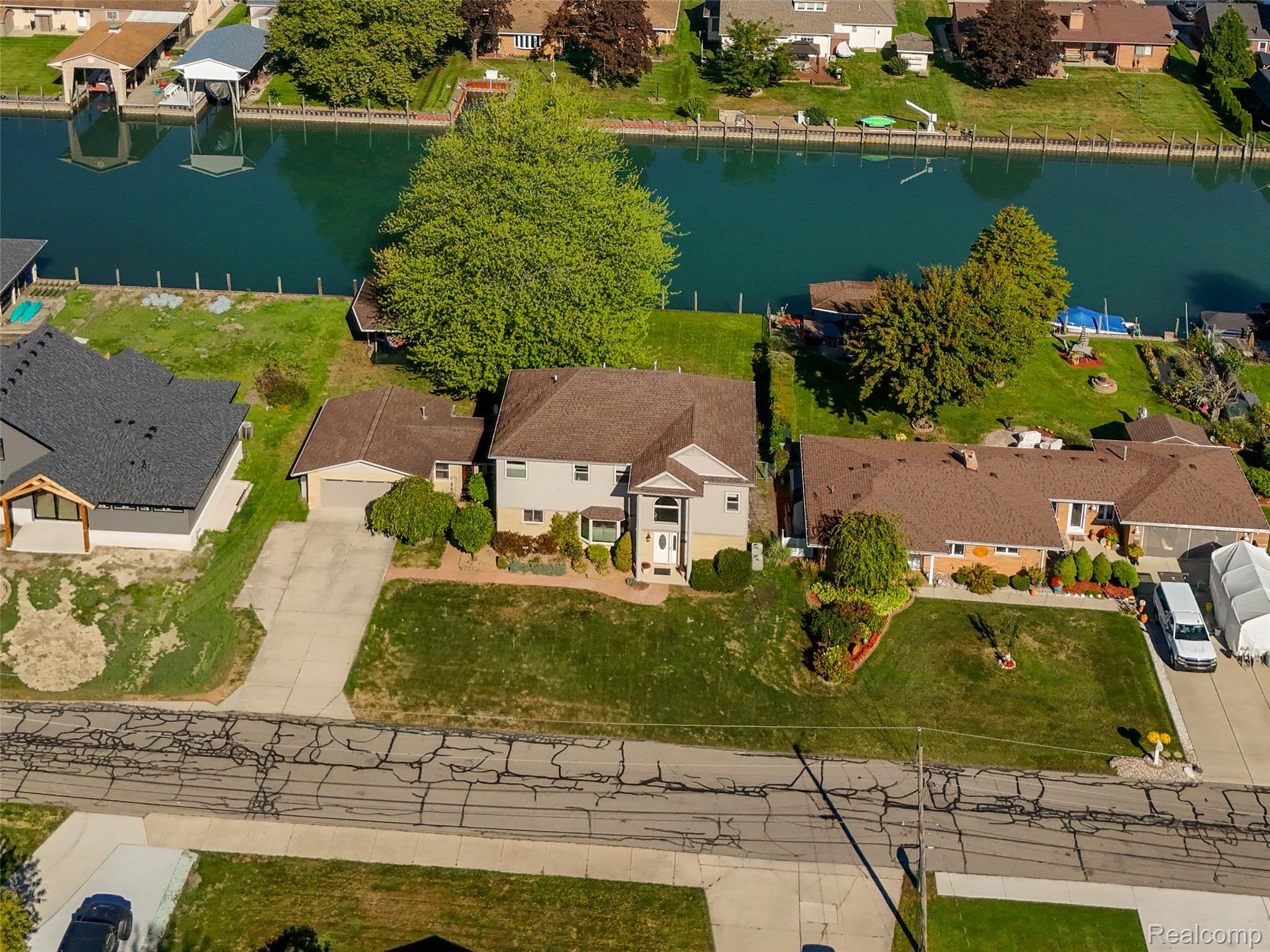 7214 Cardinal Road Algonac, MI 48001 - Photo 1 of 51 Overhead view of home and wide free flowing canal