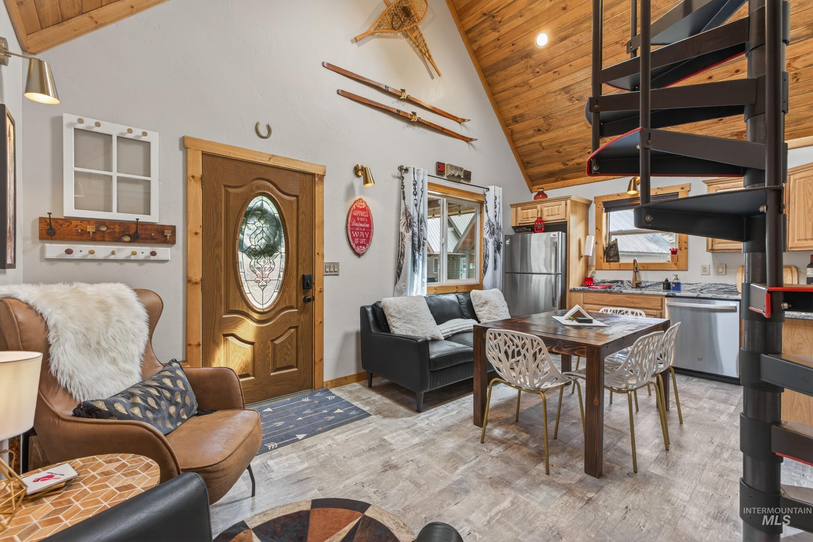 1432 Salmon Drive Riggins, ID 83549 - Photo 7 of 39 Vaulted wood-paneled ceiling accentuates the living and dining areas