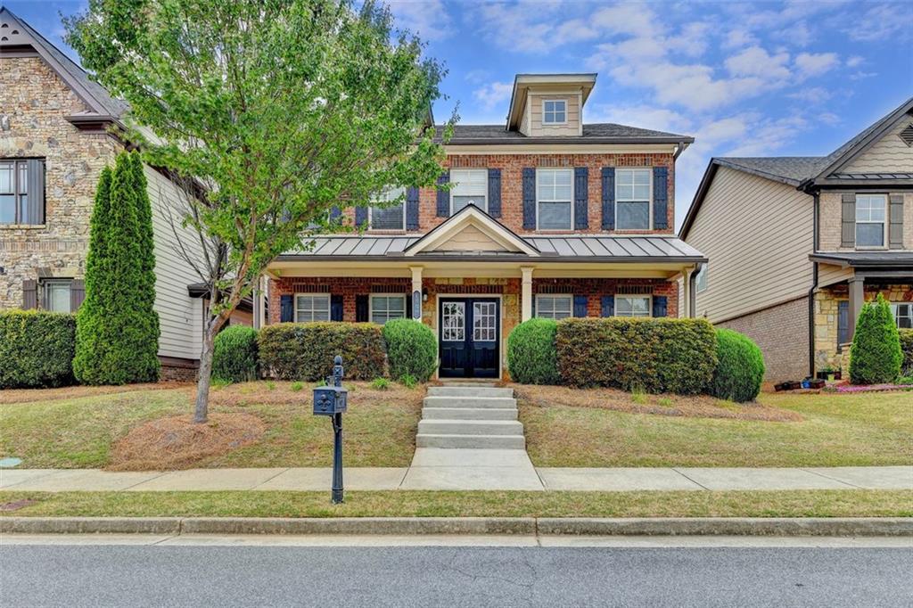 a front view of a house with yard