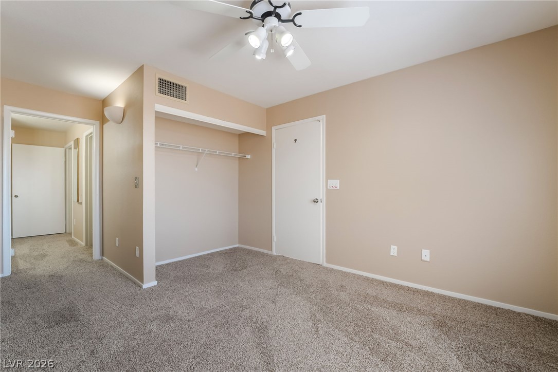 8070 West Russell Road, Unit 2024 Las Vegas, NV 89113 - Photo 11 of 19 A well-proportioned bedroom features soft carpet and a convenient closet space.