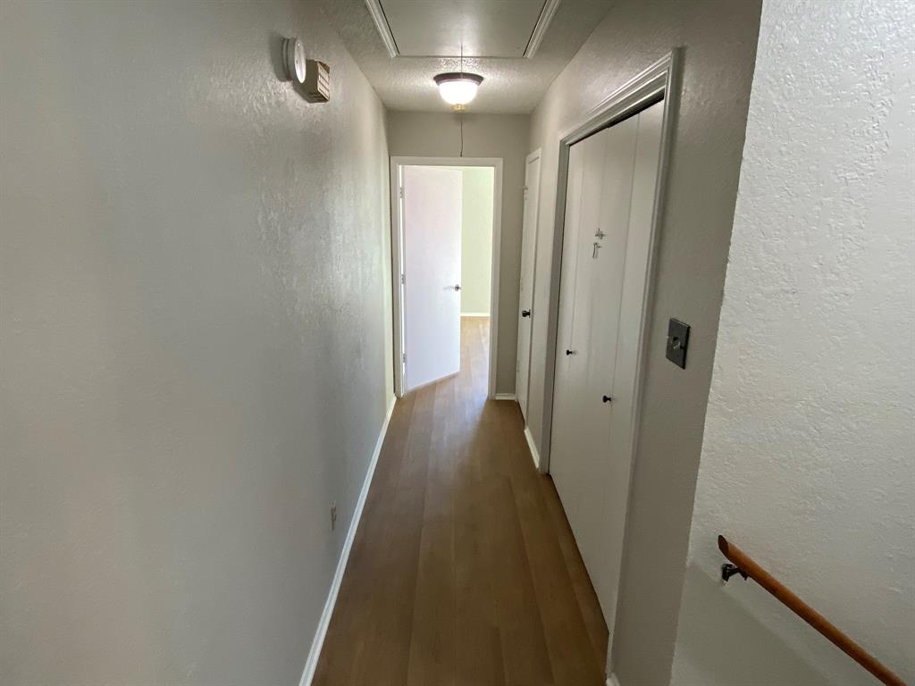 134 Main Place Euless, TX 76040 - Photo 17 of 25 a view of a hallway with wooden floor and closet