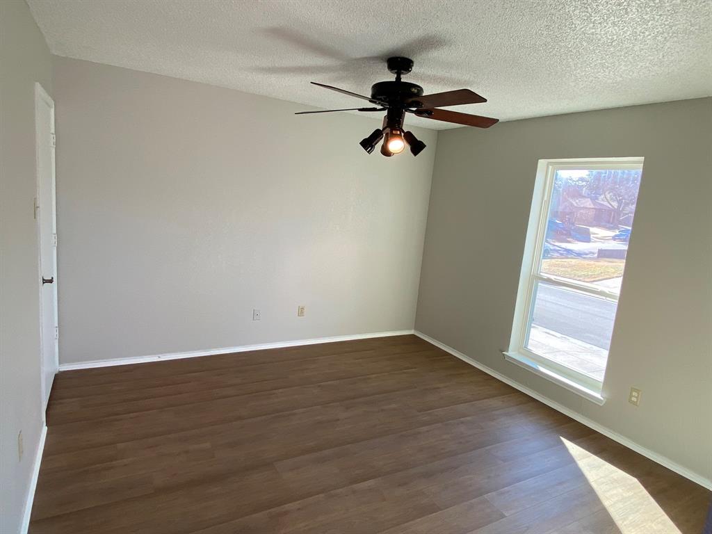 134 Main Place Euless, TX 76040 - Photo 10 of 25 wooden floor in an empty room