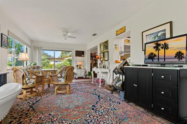 a living room filled with furniture and a flat screen tv