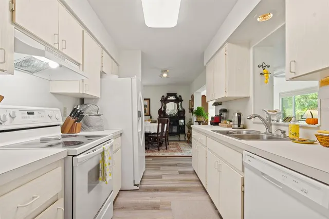 a kitchen with a sink and cabinets